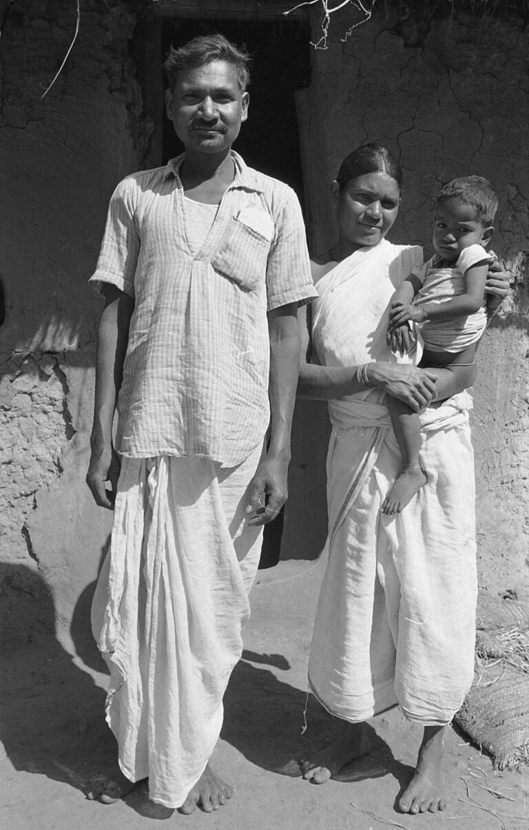 Sukuram Champia, the owner of our house and his wife Pelon and their youngest son Besera, in the courtyard that separated our houses. They have dressed up especially for this formal photo.